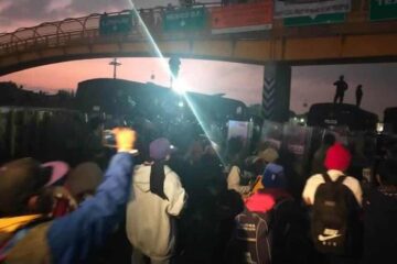 Chocan migrantes y policías de la CDMX, tras impedirles el paso en la México-Puebla